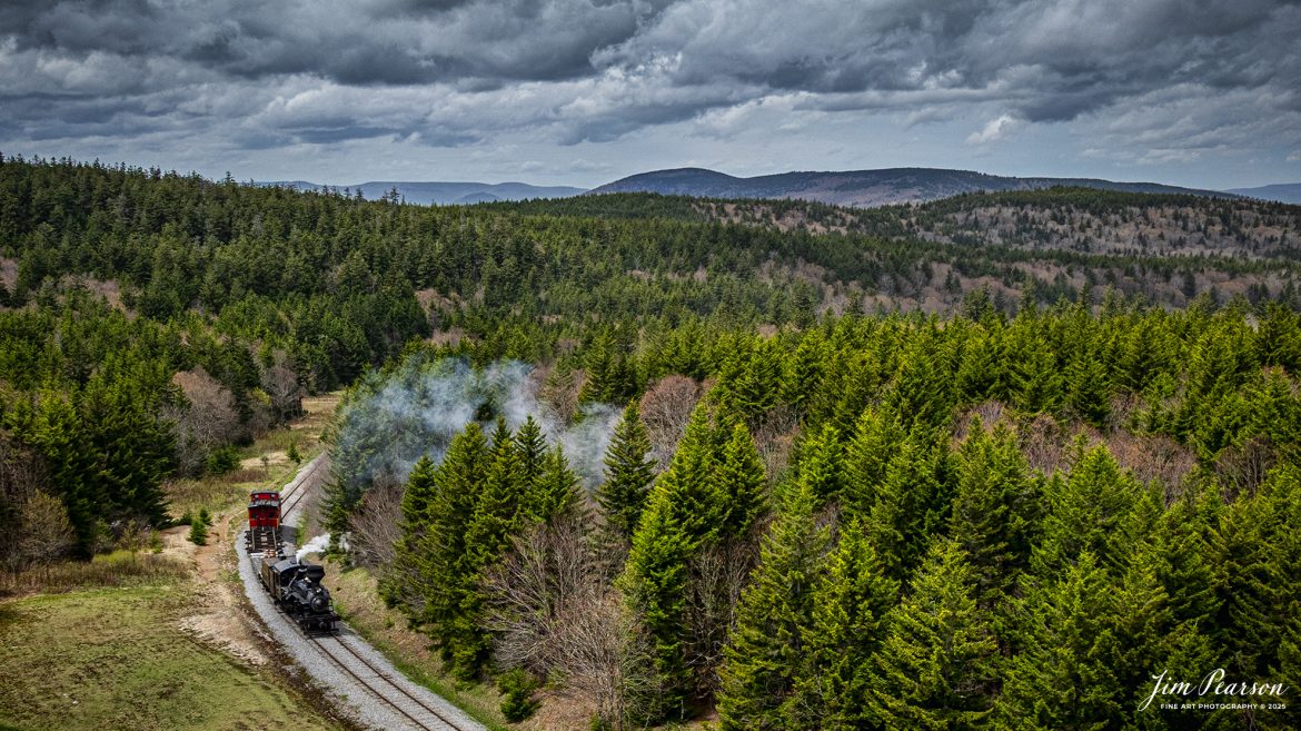 Cass Scenic Railroad Heisler#6 pulls up the hill approaching Bald Knob, WV during the Cass Spring Photographers Special, from Cass, West Virginia on May 3rd, 2025. 

According to the Mountain Rail West Virginia Website: The Meadow River Lumber No. 6 was built by the Heisler Locomotive Works in Erie, PA, in 1929 for the Bostonia Coal & Clay Products Company of New Bethlehem, PA.

The Heisler was sold to the Meadow River Lumber Company at Rainelle, WV in 1939, where it was rostered as No. 6. She retired from the lumber company in 1965 and was purchased by the purchased it by the state of West Virginia purchased. The engine ran under its own steam from Rainelle to its new home in Cass in December 1966. No. 6 would begin operating on the railroad in 1968. The Heisler is the fastest geared locomotive in the Cass collection.

Tech Info: DJI Mavic 3 Classic Drone, RAW, 24mm, f/2.8, 1/2000, ISO 130.

#railroad #railroads #train, #trains #railway #railway #steamtrains #railtransport #railroadengines #picturesoftrains #picturesofrailways #besttrainphotograph #bestphoto #photographyoftrains #bestsoldpicture #JimPearsonPhotography #trainsfromtheair #trainsfromadrone #steamtrain #casssenicrailway