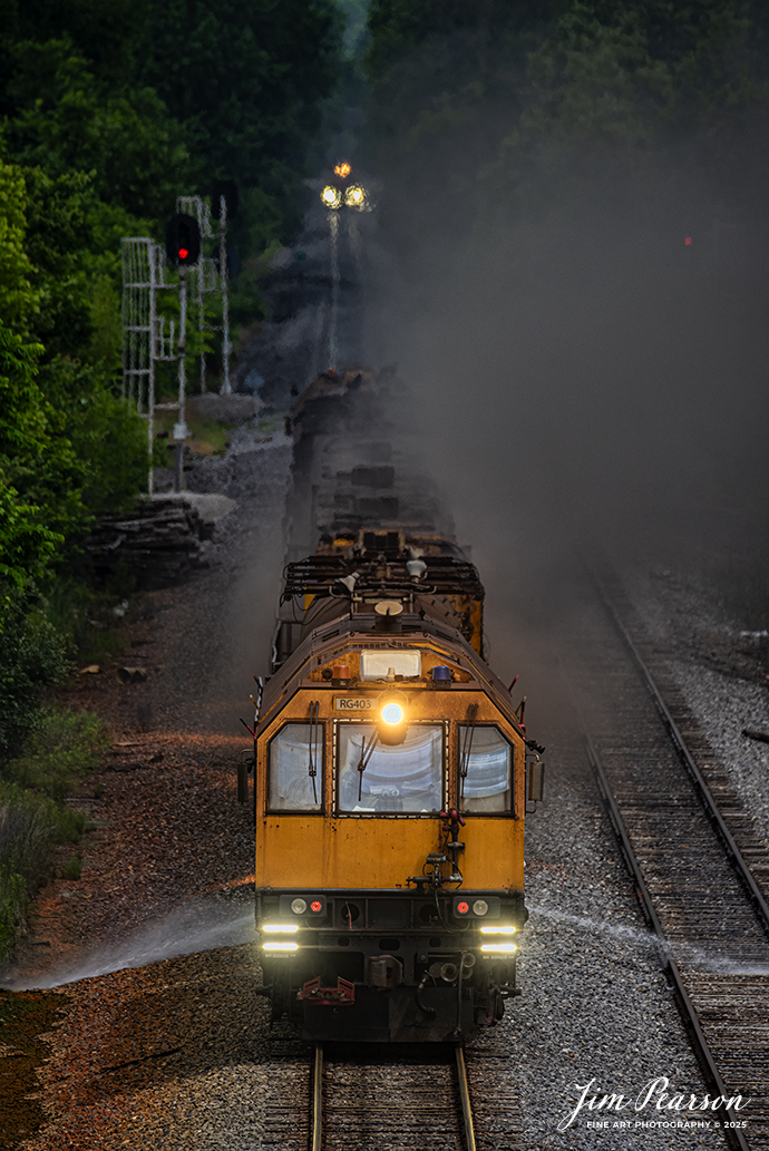 LORAM Railgrinder 403 (long grinder) heads south through the switch at the north end of the siding in Dawson Springs, Kentucky, as it works their on the Paducah and Louisville Railway, on June 5th, 2025.

The lights in the background are from the RG56, which is the short grinder that grinds switches and crossings.


According to Wikipedia: A rail grinder (or rail grinder) is a maintenance of way vehicle or train used to restore the profile and remove irregularities from worn tracks to extend its life and to improve the ride of trains using the track.

Tech Info: Nikon D810, RAW, Sigma 150-600 @ 390mm, f/6, 1/1600, ISO 320.

#railroad #railroads #train, #trains #railway #railway #steamtrains #railtransport #railroadengines #picturesoftrains #picturesofrailways #besttrainphotograph #bestphoto #photographyoftrains #bestsoldpicture #JimPearsonPhotography #Brightline #passengertrains #trainsfromtheair #trainsfromadrone #loram