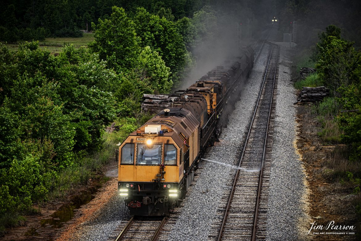 LORAM Railgrinder 403 (long grinder) heads south through the switch at the north end of the siding in Dawson Springs, Kentucky, as it works their on the Paducah and Louisville Railway, on June 5th, 2025.

The lights in the background are from the RG56, which is the short grinder that grinds switches and crossings.

According to Wikipedia: A rail grinder (or rail grinder) is a maintenance of way vehicle or train used to restore the profile and remove irregularities from worn tracks to extend its life and to improve the ride of trains using the track.

Tech Info: Nikon D810, RAW, Sigma 150-600 @ 150mm, f/5, 1/1600, ISO 220.

#railroad #railroads #train, #trains #railway #railway #steamtrains #railtransport #railroadengines #picturesoftrains #picturesofrailways #besttrainphotograph #bestphoto #photographyoftrains #bestsoldpicture #JimPearsonPhotography #Brightline #passengertrains #trainsfromtheair #trainsfromadrone #loram