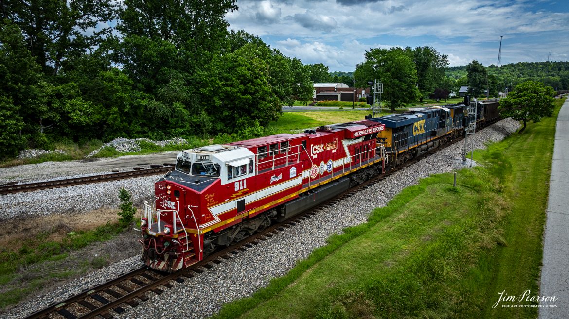 CSXT 911, Honoring our First Responders locomotive, leads empty coal train E305 as they pass through Mortons Junction at Mortons Gap, Kentucky on their way north on June 5th, 2025, on the CSX Henderson Subdivision. 

CSXT 911 is painted in vibrant red with white and gold striped accents along with the logo of program partners First Responders Children’s Foundation and Operation Gratitude. It also features generic police, fire and emergency medical services logos.

Tech Info: DJI Mavic 3 Classic Drone, RAW, 24mm, f/2.8, 1/2500, ISO 160.

#railroad #railroads #train, #trains #railway #railway #steamtrains #railtransport #railroadengines #picturesoftrains #picturesofrailways #besttrainphotograph #bestphoto #photographyoftrains #bestsoldpicture #JimPearsonPhotography #Brightline #passengertrains #trainsfromtheair #trainsfromadrone