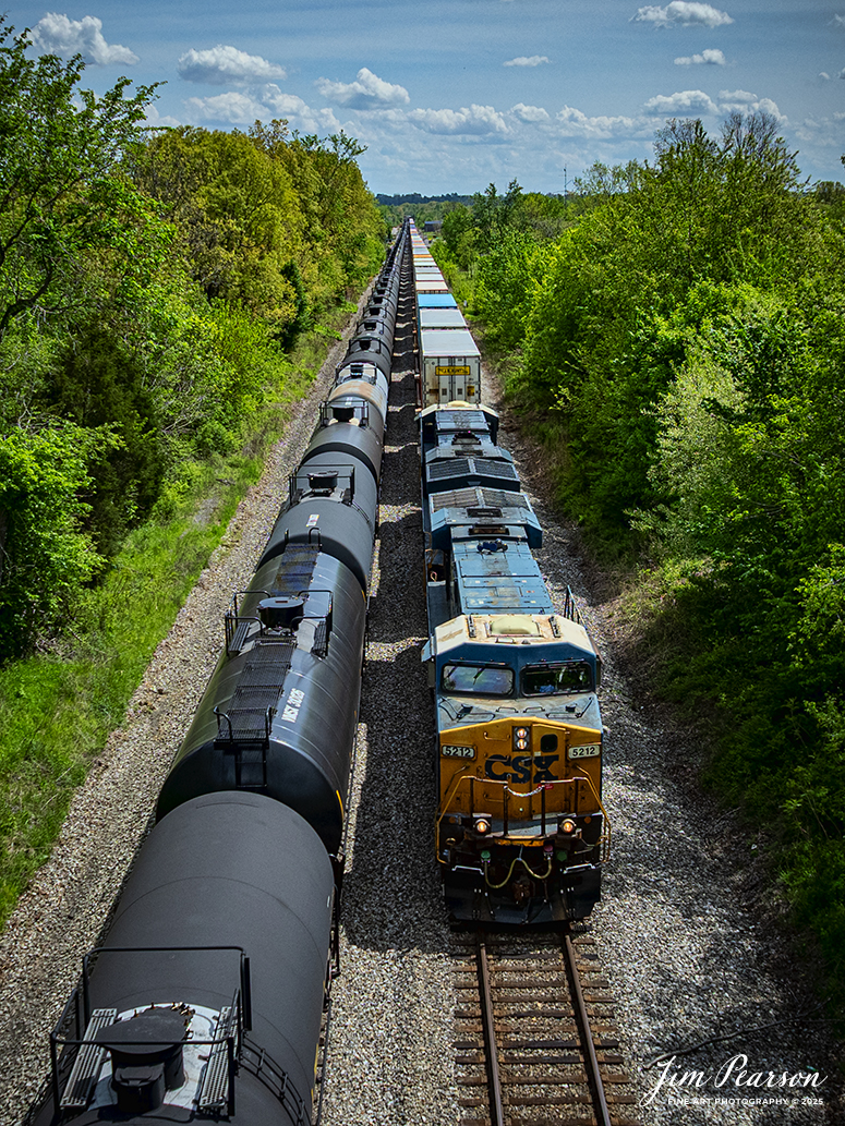 CSXT 3118 leads B621, a loaded ethanol train, as they wait in the siding at Crofton, Kentucky, as they wait for northbound intermodal I128 to pass them, on the CSX Henderson Subdivision, on April 23, 2025.

Tech Info: DJI Mavic 3 Classic Drone, RAW, 24mm, f/2.8, 1/3200, ISO 140.

#railroad #railroads #train, #trains #railway #railway #railtransport #railroadengines #picturesoftrains #picturesofrailways #besttrainphotograph #bestphoto #photographyoftrains #bestsoldpicture #JimPearsonPhotography #trainsfromadrone #csxhendersonsubdivision