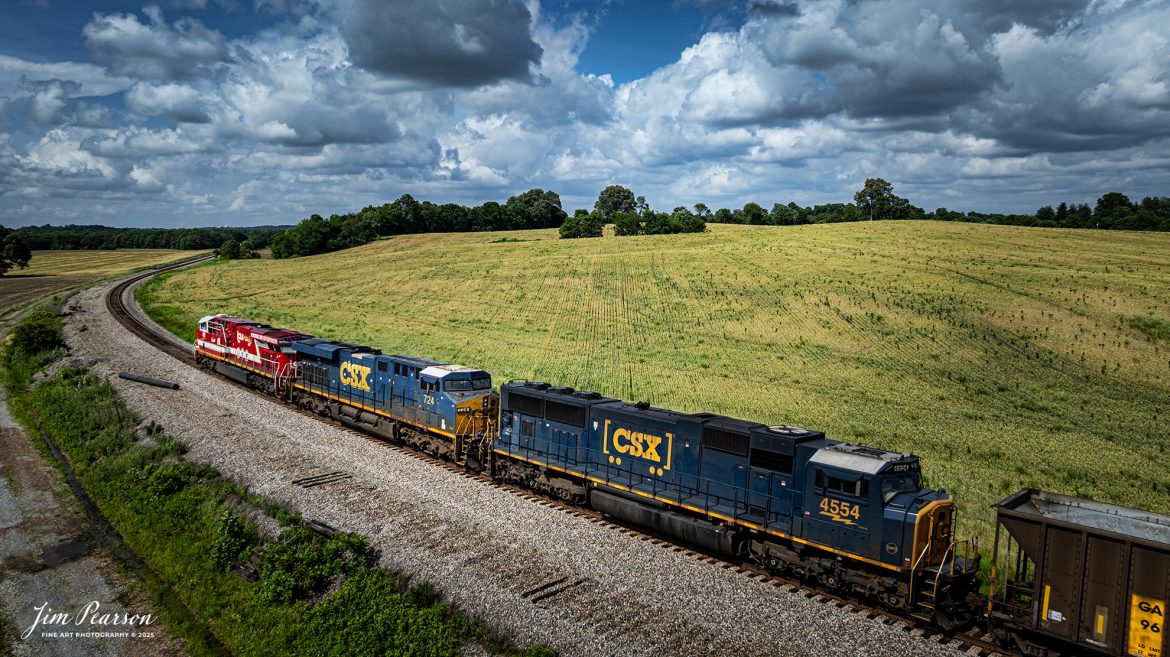 CSXT 911, Honoring our First Responders locomotive, leads empty coal train E305 as they pass through the curve at Breton, Kentucky on their way north on June 5th, 2025, on the CSX Henderson Subdivision. 

There used to be a siding at this location, but it was decommissioned a few months ago as it was too short to be of use these days. As you can tell, crews have started pulling up the rail.

CSXT 911 is painted in vibrant red with white and gold striped accents along with the logo of program partners First Responders Children’s Foundation and Operation Gratitude. It also features generic police, fire and emergency medical services logos.

Tech Info: DJI Mavic 3 Classic Drone, RAW, 24mm, f/2.8, 1/2500, ISO 100.

#railroad #railroads #train, #trains #railway #railway #steamtrains #railtransport #railroadengines #picturesoftrains #picturesofrailways #besttrainphotograph #bestphoto #photographyoftrains #bestsoldpicture #JimPearsonPhotography #Brightline #passengertrains #trainsfromtheair #trainsfromadrone