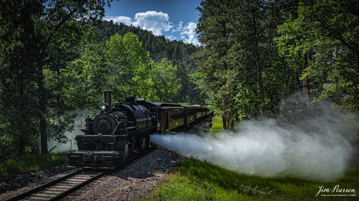 The Black Hills Central Railway locomotive 108 conducts a blowout as they pass through the Black Hills countryside as it makes its third trip of the day between Hill City to Keystone, South Dakota, on June 26th, 2025. A big shout out to Cory Jakeway for all the help on finding my way around on the railroad and railfanning with me!

According to their website: Locomotive is a 2-6-6-2T articulated tank engine that was built by the Baldwin Locomotives Works in 1926 for the Potlatch Lumber Company. It later made its way to Weyerhaeuser Timber Company and eventually to the Northwest Railway Museum in Snoqualmie, Washington.

The acquisition and subsequent restoration of locomotive 108 completed a more than 20-year goal of increasing passenger capacity which began with the restoration of 110 and the restoration of multiple passenger cars. Both large Mallet locomotives (pronounced “Malley”) can pull a full train of seven authentically restored passenger cars, up from the four cars utilized prior to their addition to the roster.

Tech Info: DJI Mavic 3 Classic Drone, RAW, 24mm, f/2.8, 1/4000, ISO 130.

#railroad #railroads #train, #trains #railway #railway #steamtrains #railtransport #railroadengines #picturesoftrains #picturesofrailways #besttrainphotograph #bestphoto #photographyoftrains #bestsoldpicture #JimPearsonPhotography #trainsfromtheair #trainsfromadrone #1880train #steamtrain #blackhills