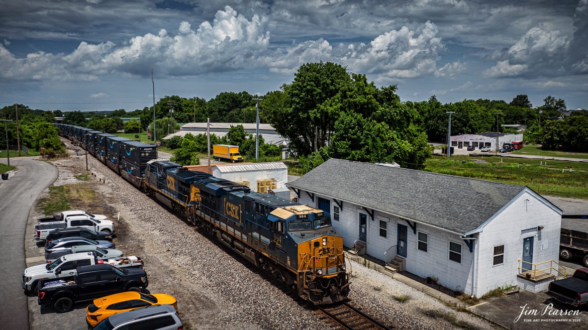 CSX Intermodal I025 passes the CSX Maintenance Facility at Springfield, Tennessee, on July 7th, 2025, as it heads south with CSXT 964 leading on the CSX Henderson Subdivision. From what I’m told, this location is where the original L&N Freight Depot once stood, and this building was built after the original building was torn down many years ago. 

Tech Info: DJI Mavic 3 Classic Drone, RAW, 22mm, f/2.8, 1/2500, ISO 100.

#railroad #railroads #train, #trains #railway #railway #steamtrains #railtransport #railroadengines #picturesoftrains #picturesofrailways #besttrainphotograph #bestphoto #photographyoftrains #bestsoldpicture #JimPearsonPhotography #trainsfromtheair #trainsfromadrone