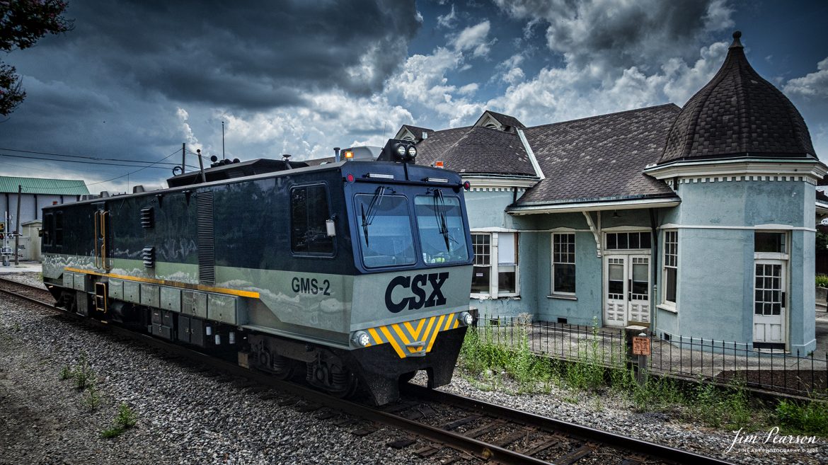 CSXT GMS-2, running as W002-22, passes the old Louisville and Nashville Railroad depot in downtown Hopkinsville, Kentucky, on the CSX Henderson Subdivision, on July 22nd, 2025. 

From what I found on the Web: G-Gauge M-Measurement S-System is one of 2 such vehicles on CSX. It puts artificial stress in different directions on the rail to simulate a passing train and measures the amount of deflection caused by said stress to determine if tie, spikes and anchor systems are functioning as needed.

Tech Info: DJI Mavic 3 Classic Drone, RAW, 22mm, f/2.8, 1/3200, ISO 250.

#railroad #railroads #train, #trains #railway #railway #steamtrains #railtransport #railroadengines #picturesoftrains #picturesofrailways #besttrainphotograph #bestphoto #photographyoftrains #bestsoldpicture #JimPearsonPhotography #trainsfromtheair #trainsfromadrone