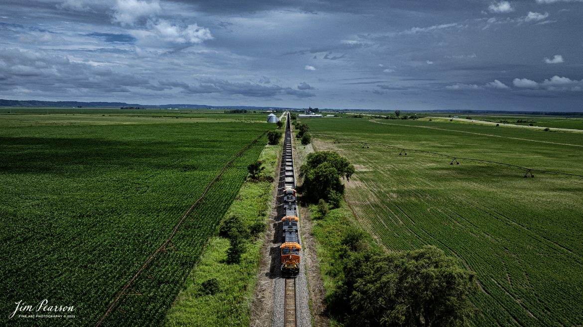 BNSF 3347 leads an empty coal train as it heads north on the BNSF Napier Subdivision at Percival, Iowa under treating skies, on June 24th, 2025.

Tech Info: DJI Mavic 3 Classic Drone, RAW, 24mm, f/2.8, 1/5000, ISO 100.

#railroad #railroads #train, #trains #railway #railway #steamtrains #railtransport #railroadengines #picturesoftrains #picturesofrailways #besttrainphotograph #bestphoto #photographyoftrains #bestsoldpicture #JimPearsonPhotography #trainsfromtheair #trainsfromadrone #bnsfrailway
