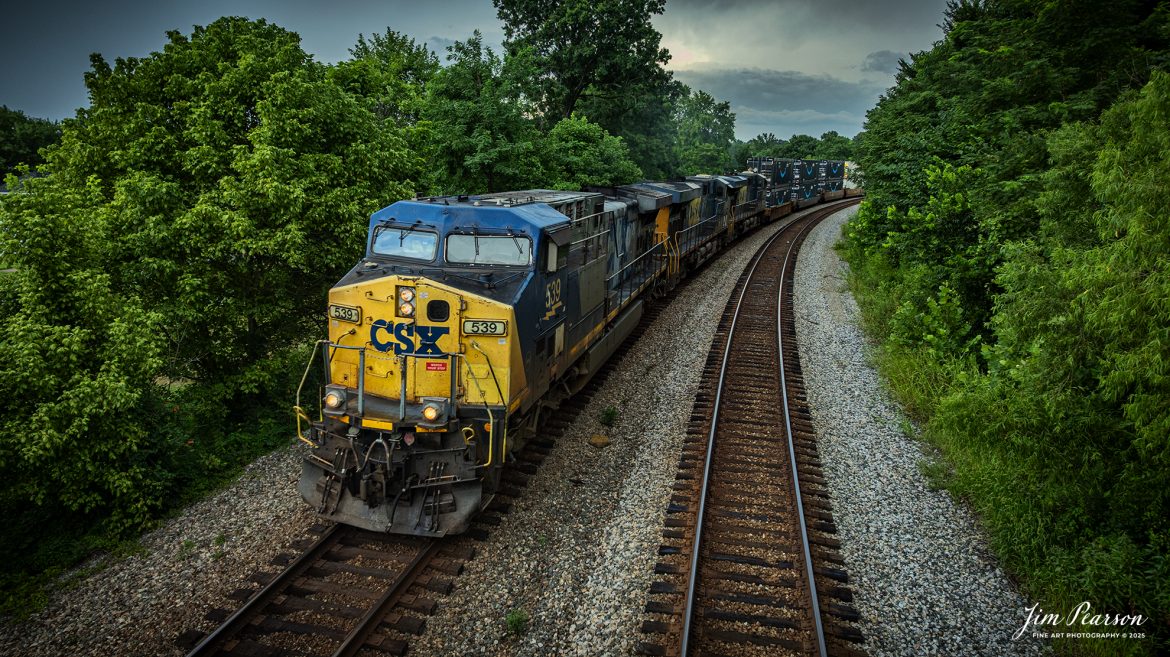 CSXT 539 leads daily intermodal I128 as it heads north through a curve at Nortonville, Kentucky, on July 21st, 2025, on the CSX Henderson Subdivision. This train runs between Fairburn, Georgia and Bedford Park, Illinois and it’s counterpart, CSX I129 runs the opposite direction daily as well.

Tech Info: DJI Mavic 3 Classic Drone, RAW, 22mm, f/2.8, 1/500, ISO 210

#railroad #railroads #train, #trains #railway #railway #steamtrains #railtransport #railroadengines #picturesoftrains #picturesofrailways #besttrainphotograph #bestphoto #photographyoftrains #bestsoldpicture #JimPearsonPhotography #trainsfromtheair #trainsfromadrone #onecsx #csx