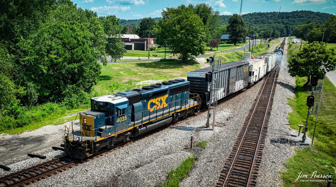CSXT 4035 leads weed spraying train W054 as they work their way north at 15mph at Mortons Junction onto the cutoff at Mortons Gap, Kentucky on July 30th, 2025, on the CSX Henderson Subdivision. 

According to Wikipedia: A weed sprayer train controls the growth of weeds and other vegetation along railroad right-of-ways that can cause significant issues with drainage, obstruct worker access and become a nuisance to adjacent property owners. 

Tech Info: This is a 4K video frame grab shot by my DJI Mavic 3 Classic Drone, RAW, 22mm.

#railroad #railroads #train, #trains #railway #railway #steamtrains #railtransport #railroadengines #picturesoftrains #picturesofrailways #besttrainphotograph #bestphoto #photographyoftrains #bestsoldpicture #JimPearsonPhotography #trainsfromtheair #trainsfromadrone #onecsx #csx