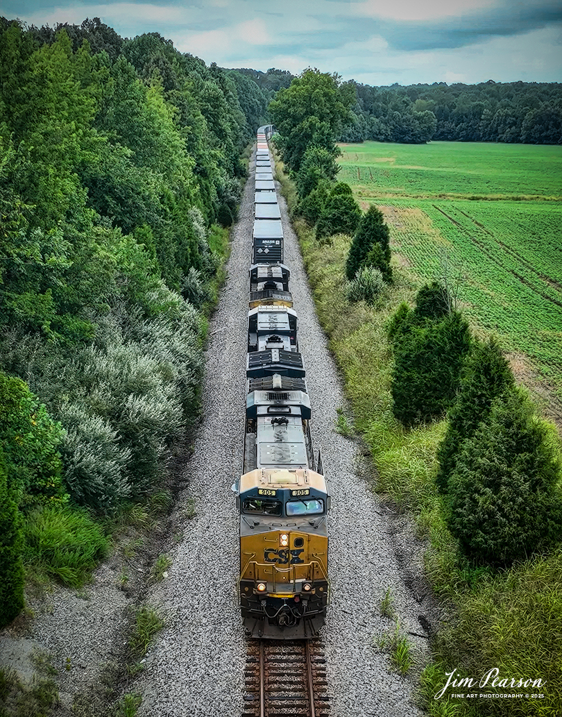 CSXT 905 leads hot intermodal I025 as it heads north just outside of Hanson, Kentucky, on August 4th, 2025, on the CSX Henderson Subdivision. This train runs between Bedford Park, Illinois Bedford Park, IL and Jacksonville, Forida and its counterpart, CSX I026 runs the opposite direction daily as well.

Tech Info: 4K Frame Grab from a DJI Mavic 3 Classic Drone, RAW, 22mm, f/2.8.

#railroad #railroads #train, #trains #railway #railway #steamtrains #railtransport #railroadengines #picturesoftrains #picturesofrailways #besttrainphotograph #bestphoto #photographyoftrains #bestsoldpicture #JimPearsonPhotography #trainsfromtheair #trainsfromadrone #onecsx #csx