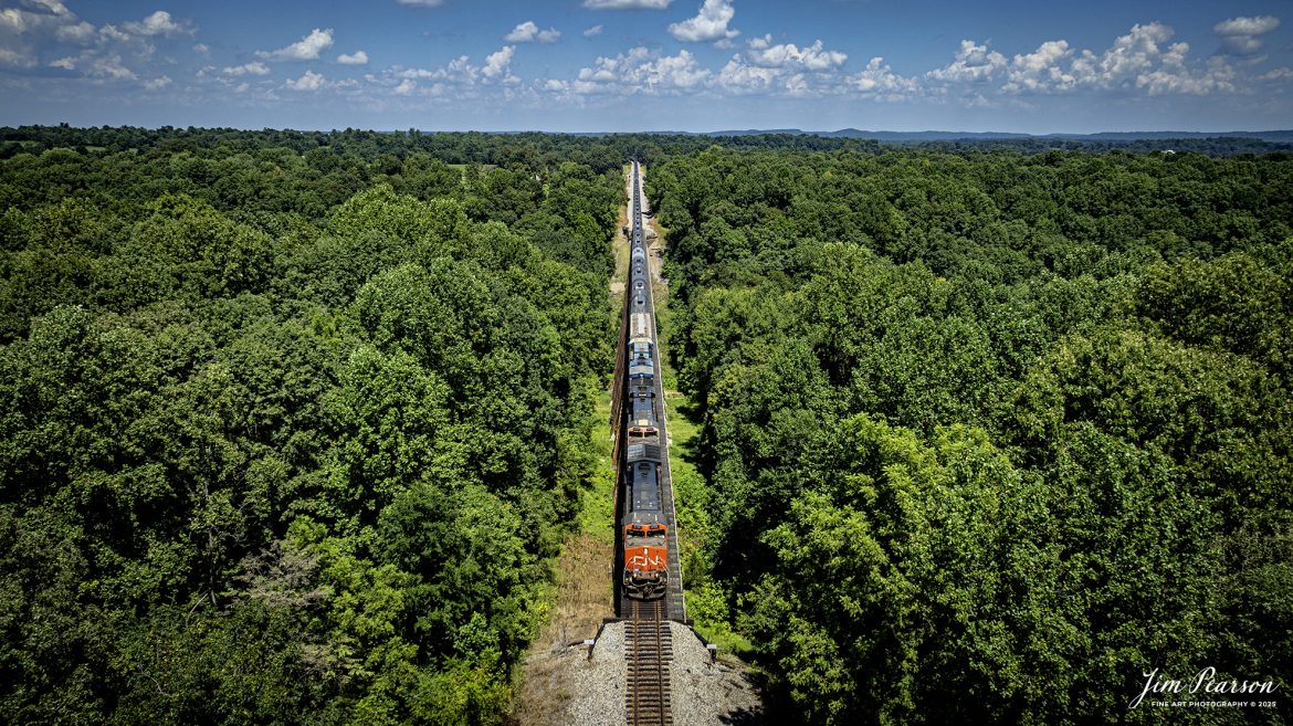 Canadian National 2705 leads CSX B211, a loaded ethanol train over the gum lick trestle just north of Kelly, Kentucky as they make their way south on the CSX Henderson Subdivision on August 15th, 2025.

Tech Info: DJI Mavic 3 Classic Drone, RAW, 22mm, f/2.8, 1/2000, ISO 100

#railroad #railroads #train, #trains #railway #railway #steamtrains #railtransport #railroadengines #picturesoftrains #picturesofrailways #besttrainphotograph #bestphoto #photographyoftrains #bestsoldpicture #JimPearsonPhotography #trainsfromtheair #trainsfromadrone #onecsx #csx #cnrailway
