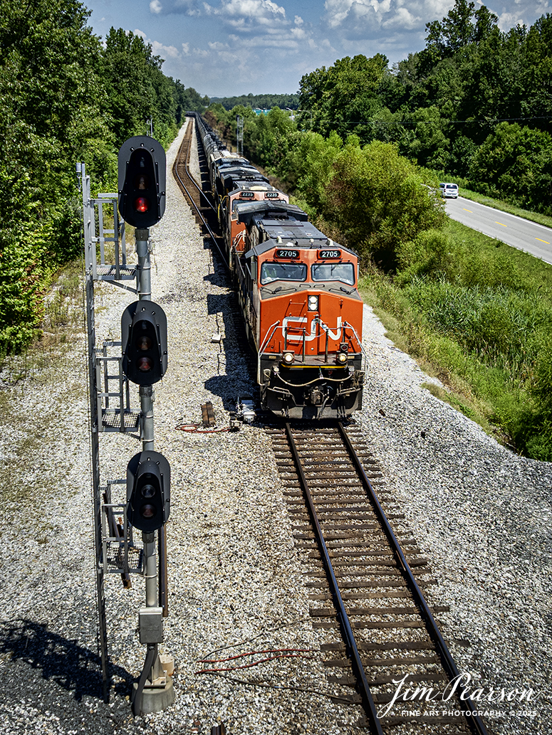 Canadian National 2705 leads CSX B211, a loaded ethanol train past the signals at Romney, just south of Nortonville, Kentucky as they make their way south on the CSX Henderson Subdivision on August 15th, 2025.

Tech Info: DJI Mavic 3 Classic Drone, RAW, 22mm, f/2.8, 1/1600, ISO 100

#railroad #railroads #train, #trains #railway #railway #steamtrains #railtransport #railroadengines #picturesoftrains #picturesofrailways #besttrainphotograph #bestphoto #photographyoftrains #bestsoldpicture #JimPearsonPhotography #trainsfromtheair #trainsfromadrone #onecsx #csx #cnrailway