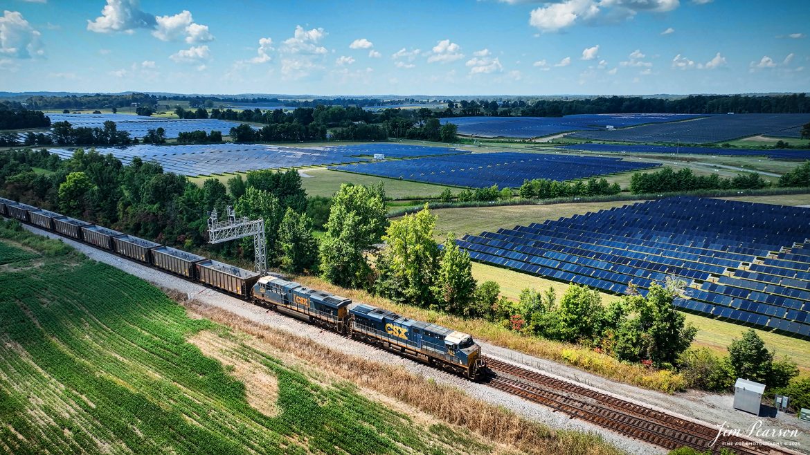 CSXT 855 and 3023 lead empty coal train E304 as it heads north at Anaconda, Robards, Kentucky, passing the newly constructed solar energy farm in the background, on the CSX Henderson Subdivision on August 16th, 2025.

Tech Info: 4K Frame Grab from a DJI Mavic 3 Classic Drone, RAW, 22mm, f/2.8.

#railroad #railroads #train, #trains #railway #railway #steamtrains #railtransport #railroadengines #picturesoftrains #picturesofrailways #besttrainphotograph #bestphoto #photographyoftrains #bestsoldpicture #JimPearsonPhotography #trainsfromtheair #trainsfromadrone #onecsx #csx