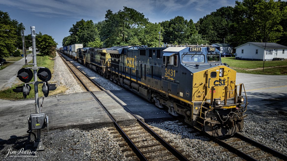 CSX I025 creeps through the crossing at Robards, Kentucky on August 16th, 2025, on the CSX Henderson Subdivision, since one of it's cars had a hotbox.

Due to the “hotbox” I025 was delayed by two hours and CSX M502 and I128 sat between here and Sebree, Ky waiting to head north through the crossover here at Anaconda. I025 is the hottest train on the Henderson Subdivision and normally all trains get out of their way as they make their way south.

Tech Info: 4K Frame Grab from a DJI Mavic 3 Classic Drone, RAW, 22mm, f/2.8.

#railroad #railroads #train, #trains #railway #railway #steamtrains #railtransport #railroadengines #picturesoftrains #picturesofrailways #besttrainphotograph #bestphoto #photographyoftrains #bestsoldpicture #JimPearsonPhotography #trainsfromtheair #trainsfromadrone #onecsx #csx