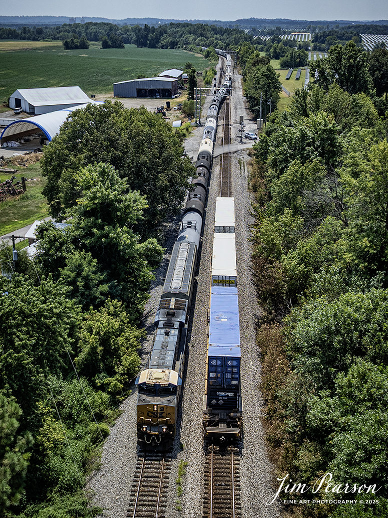 CSX M502 passes a cut of trailers that intermodal CSX I025 set out because of a “hotbox” at the north end of Anaconda, as they proceed on north at Robards, Kentucky on August 16th, 2025, on the CSX Henderson Subdivision.

Tech Info: DJI Mavic 3 Classic Drone, RAW, 22mm, f/2.8, 1/2500, ISO 140

#railroad #railroads #train, #trains #railway #railway #steamtrains #railtransport #railroadengines #picturesoftrains #picturesofrailways #besttrainphotograph #bestphoto #photographyoftrains #bestsoldpicture #JimPearsonPhotography #trainsfromtheair #trainsfromadrone #onecsx #csx
