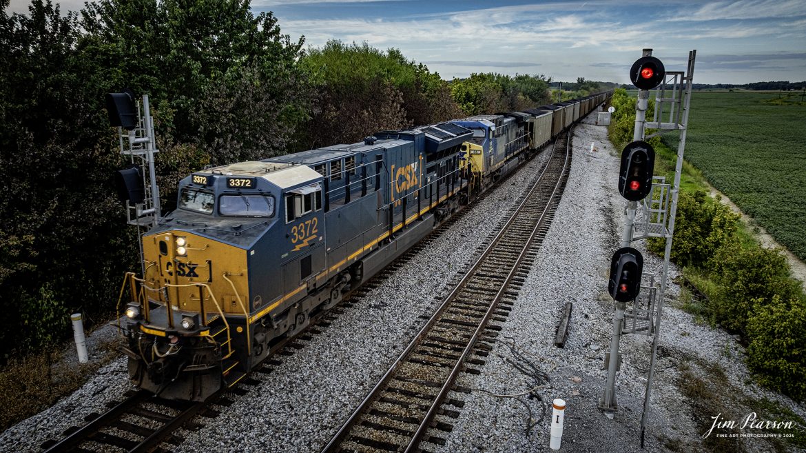 CSXT 3372 leads C303 southbound past the signals at the north end of the siding at Slaughters, Kentucky at it heads south on August 27th, 2025, on the CSX Henderson Subdivision. This train runs between Evansville, IN (EVWR)	Plant Bowen - Stilesboro, GA and Sugar Camp Mine on the EVWR.

Tech Info: DJI Mavic 3 Classic Drone, RAW, 22mm, f/2.8, 1/640, ISO 200

#railroad #railroads #train, #trains #railway #railway #steamtrains #railtransport #railroadengines #picturesoftrains #picturesofrailways #besttrainphotograph #bestphoto #photographyoftrains #bestsoldpicture #JimPearsonPhotography #trainsfromtheair #trainsfromadrone #onecsx #csx