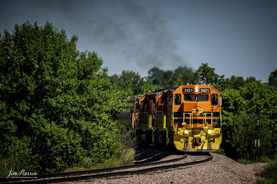 Rapid City, Pierre & Eastern Railroad (RCPE) 3421 leads their train eastbound through the countryside along I90, as they head for Rapid City, South Dakota on the Black Hills Subdivision, on June 26th, 2025.

According to Wikipedia, the Rapid City, Pierre & Eastern Railroad (reporting mark RCPE) is a Class II freight railroad operating across South Dakota and southern Minnesota in the northern plains of the United States. Portions of the railroad also extend into Wyoming and Nebraska. It is owned and operated by Genesee & Wyoming. The primary commodities shipped are grain, clay, and cement. Operations began on June 1, 2014.

Genesee & Wyoming, a holding company of mostly short line railroads, formed the Rapid City, Pierre & Eastern to acquire the western end of the former Dakota, Minnesota and Eastern Railroad (DM&E) rail line from the Canadian Pacific Railway (CPR). The RCPE and DM&E entered an agreement on January 2, 2014, wherein RCPE would acquire 670 miles of track and 219 miles of trackage rights from the DM&E. The acquisition was completed on May 30, 2014, for $210 million. Most of its employees came from the DM&E.

Tech Info: Nikon Z6ii, RAW, Nikon 70-300 @ 300mm, f/4, 1/1600, ISO 360

#railroad #railroads #train, #trains #railway #railway #steamtrains #railtransport #railroadengines #picturesoftrains #picturesofrailways #besttrainphotograph #bestphoto #photographyoftrains #bestsoldpicture #JimPearsonPhotography