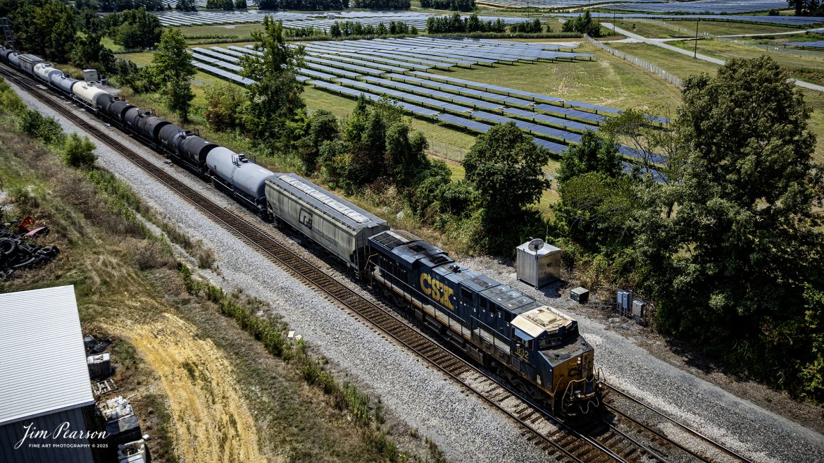 CSXT 932 leads CSX M502 through the crossover as it heads north at Anaconda, Robards, Kentucky, passing the newly constructed solar energy farm in the background, on the CSX Henderson Subdivision on August 16th, 2025.

Tech Info: 4K Frame Grab from a DJI Mavic 3 Classic Drone, RAW, 22mm, f/2.8.

#railroad #railroads #train, #trains #railway #railway #steamtrains #railtransport #railroadengines #picturesoftrains #picturesofrailways #besttrainphotograph #bestphoto #photographyoftrains #bestsoldpicture #JimPearsonPhotography #trainsfromtheair #trainsfromadrone #onecsx #csx