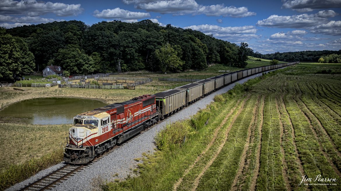 Paducah and Louisville Railway 2013 University of Louisville locomotive brings up the rear as the DPU on a northbound loaded Louisville, Gas and Electric coal train as they pass through the valley at Do Stop, just south of Caneyville, Kentucky, on August 26th, 2025. 

According to Wikipedia: The Paducah & Louisville Railway (reporting mark PAL) is a Class II railroad that operates freight service between Paducah and Louisville, Kentucky. The line is located entirely within the Commonwealth of Kentucky.

The 270-mile (430 km) line was purchased from Illinois Central Gulf Railroad in August of 1986.

Tech Info: DJI Mavic 3 Classic Drone, RAW, 22mm, f/2.8, 1/2000, ISO 100

#railroad #railroads #train, #trains #railway #railway #steamtrains #railtransport #railroadengines #picturesoftrains #picturesofrailways #besttrainphotograph #bestphoto #photographyoftrains #bestsoldpicture #JimPearsonPhotography #trainsfromtheair #trainsfromadrone #paducahandlouisvillerailway