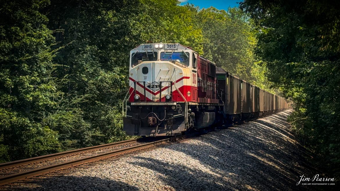 Paducah and Louisville Railway 2013 University of Louisville locomotive brings up the rear as the DPU on a northbound loaded Louisville, Gas and Electric coal train just south of Pond River out of Madisonville, Kentucky, on August 26th, 2025. 

According to Wikipedia: The Paducah & Louisville Railway (reporting mark PAL) is a Class II railroad that operates freight service between Paducah and Louisville, Kentucky. The line is located entirely within the Commonwealth of Kentucky.

The 270-mile (430 km) line was purchased from Illinois Central Gulf Railroad in August of 1986.

Tech Info:4K Video Frame Grab from a DJI Mavic 3 Classic Drone

#railroad #railroads #train, #trains #railway #railway #steamtrains #railtransport #railroadengines #picturesoftrains #picturesofrailways #besttrainphotograph #bestphoto #photographyoftrains #bestsoldpicture #JimPearsonPhotography #trainsfromtheair #trainsfromadrone #paducahandlouisvillerailway
