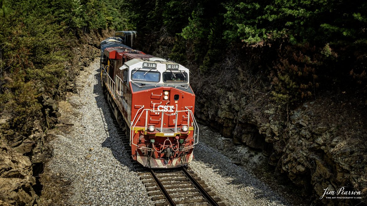 CSXT 911, Honoring First Responders Locomotive, leads southbound I025 as it passes through Sand Cut, north of Crofton, Kentucky on September 10th, 2025, on the CSX Henderson Subdivision.

CSXT 911 is painted in vibrant red with white and gold striped accents along with the logo of program partners First Responders Children’s Foundation and Operation Gratitude. It also features generic police, fire and emergency medical services logos.

Tech Info: DJI Mavic 3 Classic Drone, RAW, 22mm, f/2.8, 1/1000, ISO 130

#railroad #railroads #train, #trains #railway #railway #railtransport #railroadengines #picturesoftrains #picturesofrailways #besttrainphotograph #bestphoto #photographyoftrains #bestsoldpicture #JimPearsonPhotography #trainsfromtheair #trainsfromadrone #onecsx #csx