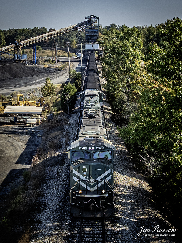 Paducah and Louisville Railway 4512 and 4121 lead the Louisville Gas and Electric coal train as it pulls under the loadout at Warrior Coal Mine loop, just outside of Nebo, Kentucky, on September 18th, 2025.

Tech Info: DJI Mavic 3 Classic Drone, RAW, 22mm, f/2.8, 1/2000, ISO 140

#railroad #railroads #train, #trains #railway #railway #railtransport #railroadengines #picturesoftrains #picturesofrailways #besttrainphotograph #bestphoto #photographyoftrains #bestsoldpicture #JimPearsonPhotography #trainsfromtheair #trainsfromadrone #paducahandlouisvillerailway