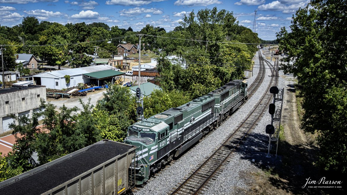 Paducah and Louisville Railway 4503 and 4521 lead a loaded Louisville, Gas and Electric coal train north at Central City, Kentucky, on August 26th, 2025. 

According to Wikipedia: The Paducah & Louisville Railway (reporting mark PAL) is a Class II railroad that operates freight service between Paducah and Louisville, Kentucky. The line is located entirely within the Commonwealth of Kentucky.

The 270-mile (430 km) line was purchased from Illinois Central Gulf Railroad in August of 1986.

Tech Info: DJI Mavic 3 Classic Drone, RAW, 22mm, f/2.8, 1/2000, ISO 110

#railroad #railroads #train, #trains #railway #railway #steamtrains #railtransport #railroadengines #picturesoftrains #picturesofrailways #besttrainphotograph #bestphoto #photographyoftrains #bestsoldpicture #JimPearsonPhotography #trainsfromtheair #trainsfromadrone #paducahandlouisvillerailway