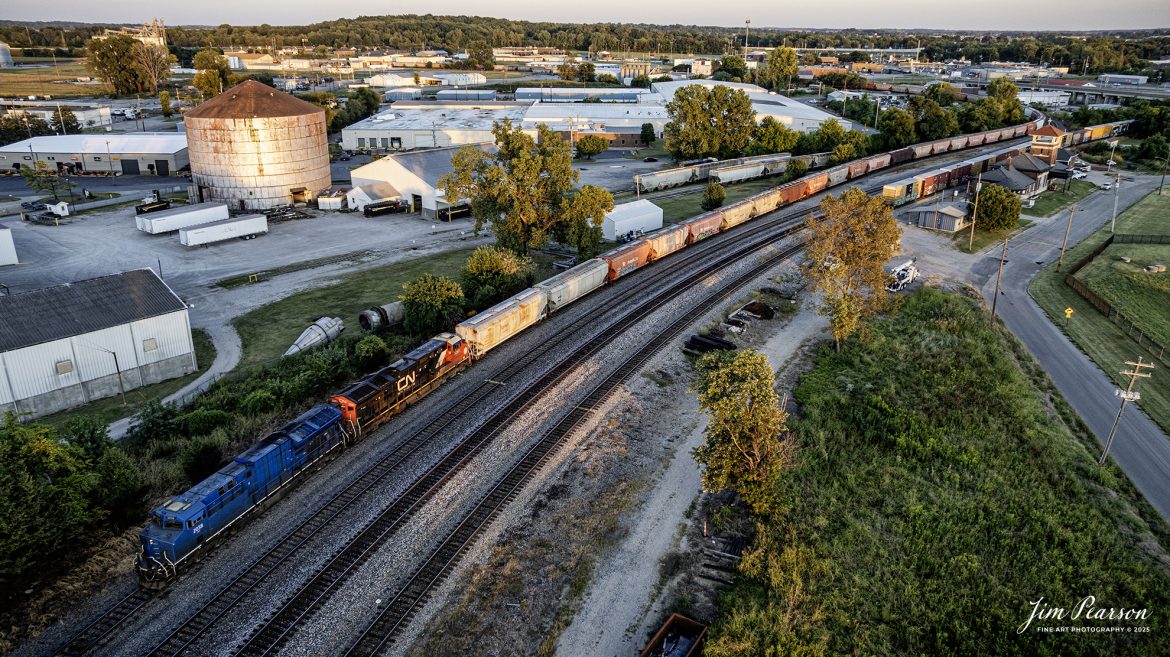 This isn’t the shot I had planned for this train, and the day for this train didn’t go as planned for the crew either!

I waited across the river at Henderson, Kentucky for this B237 phosphate loads, which were scheduled to take the Texas Line here at Henderson, Ky, but wires got crossed and their train was sent south along the Henderson Subdivision, until the dispatcher realized they were supposed to take the Texas line to Louisville, Ky.

So, the train went to the siding at Rankin, which is about 5 miles south of Henderson where the crew ran their power around the train and then pulled their loads back through Henderson. Then they backed their train onto the Texas Line, which you can see snaking off in the distance to the left. 

They then sat there to allow a few trains to get by as they were blocking the main. After this shot, which I didn’t wait for as it was dark, they ran back around their train and took it onto Louisville. 

A missed thrown switch and light cost this crew and train an extra 3 or more hours as that’s how long it took for all this to happen.

There’s a draw bridge at Spottsville, Ky where I sat for two of those hours waiting to photograph him at. There’ll be others though and some days it goes like this!

The old L&N Depot is in the upper right corner of this shot and is currently under restoration.

The blue engine is GECX 2038, and the other is Canadian National 3281.

Tech Info: DJI Mavic 3 Classic Drone, RAW, 22mm, f/2.8, 1/160, ISO 160

#railroad #railroads #train, #trains #railway #railway #railtransport #railroadengines #picturesoftrains #picturesofrailways #besttrainphotograph #bestphoto #photographyoftrains #bestsoldpicture #JimPearsonPhotography #trainsfromtheair #trainsfromadrone #onecsx #csx
