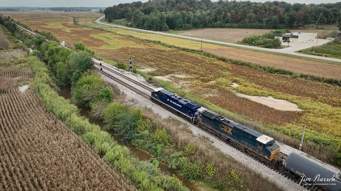 CSXT 1981 Pan Am Railways Heritage Unit leads M512 as they head north from Slaughters, Kentucky, on September 24th, 2025, on the CSX Henderson Subdivision.

According to a CSXT Press Release: November 25, 2024 – CSX has unveiled locomotive No. 1981, the final installment in its series of heritage locomotives, honoring Pan Am Railways. The unit is the 21st and final creation by the Waycross Paint Shop to celebrate the predecessor railroads that form today’s CSX network.

Pan Am Railways, formerly known as Guilford Transportation, was established in 1981 and operated across northern New England, spanning from Maine to New York. It joined the CSX family in 2022 following a purchase agreement.

The heritage series required extra care and precision, according to CSX carman painter Albert Bussey. “It’s always special working on the heritage units,” Bussey said. “Like always, we try to take a little bit of extra care and time in order to do these perfectly.”

All 21 heritage units are not just displays of craftsmanship but active locomotives performing daily duties throughout CSX’s 26-state rail network. The dedication behind their creation reflects the artistry of the team at the Waycross Paint Shop.

The completion of locomotive No. 1981 stands as a tribute to the history of Pan Am Railways and the pride shared by CSX employees. As CSX approaches its 200th anniversary in 2027, these heritage locomotives symbolize the company’s enduring legacy and its dedication to innovation and service.

Tech Info: 4K Frame Grab from a DJI Mavic 3 Classic Drone, RAW, 22mm, f/2.8.

#railroad #railroads #train, #trains #railway #railway #steamtrains #railtransport #railroadengines #picturesoftrains #picturesofrailways #besttrainphotograph #bestphoto #photographyoftrains #bestsoldpicture #JimPearsonPhotography #trainsfromtheair #trainsfromadrone #onecsx #csx