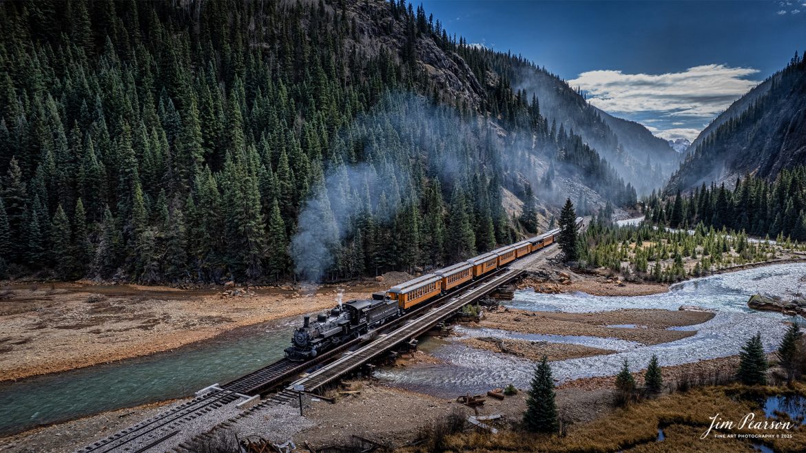 Durango and Silverton Railroad engine 482 leads the daily passenger train across the  Animas River as they head to Silverton, Colorado on October 22, 2025.
According to Wikipedia, D&SNG No. 482 is a K-36 class 2-8-2 "Mikado" type narrow gauge steam locomotive. It was originally built by the Baldwin Locomotive Works in 1925 for the Denver & Rio Grande Western Railroad (D&RGW) and is now preserved as a permanent resident of the Durango & Silverton Narrow Gauge Railroad (D&SNG) in Durango, CO.
Tech Info: DJI Air 2S Drone, RAW, 22mm, f/2.8, 1/1250, ISO 100
#railroad #railroads #train, #trains #railway #railway #railtransport #railroadengines #picturesoftrains #picturesofrailways #besttrainphotograph #bestphoto #photographyoftrains #bestsoldpicture #JimPearsonPhotography #trainsfromtheair #trainsfromadrone #steamtrain #DSNGRR